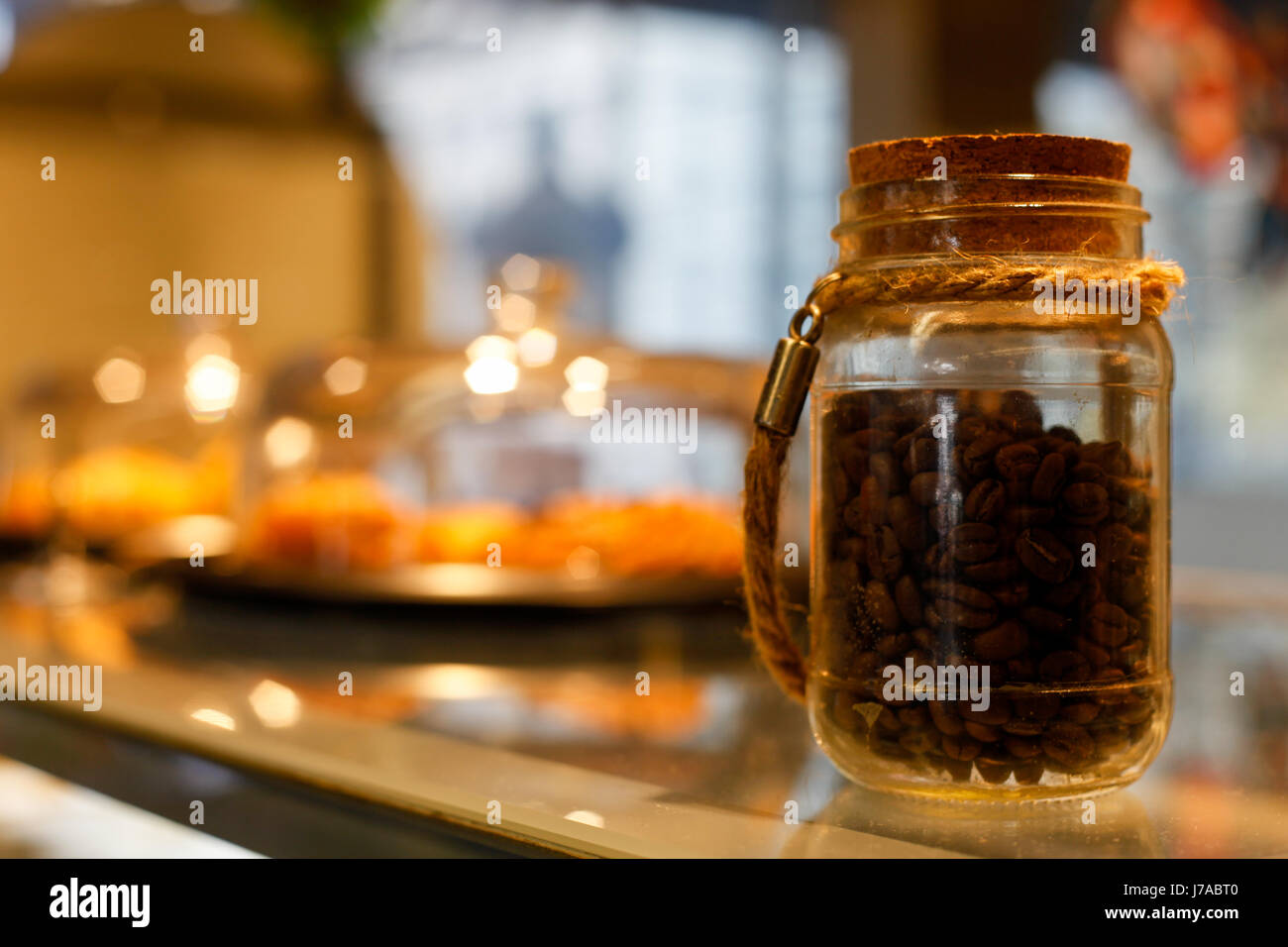 Jar of coffee beans in a trendy café Stock Photo