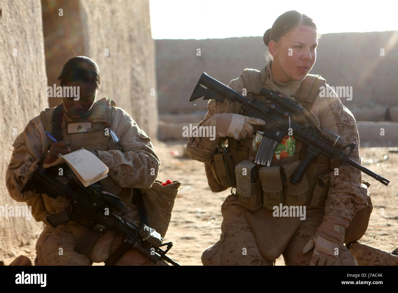 U.S. Marines assigned to the female engagement team on patrol in Afghanistan. Stock Photo