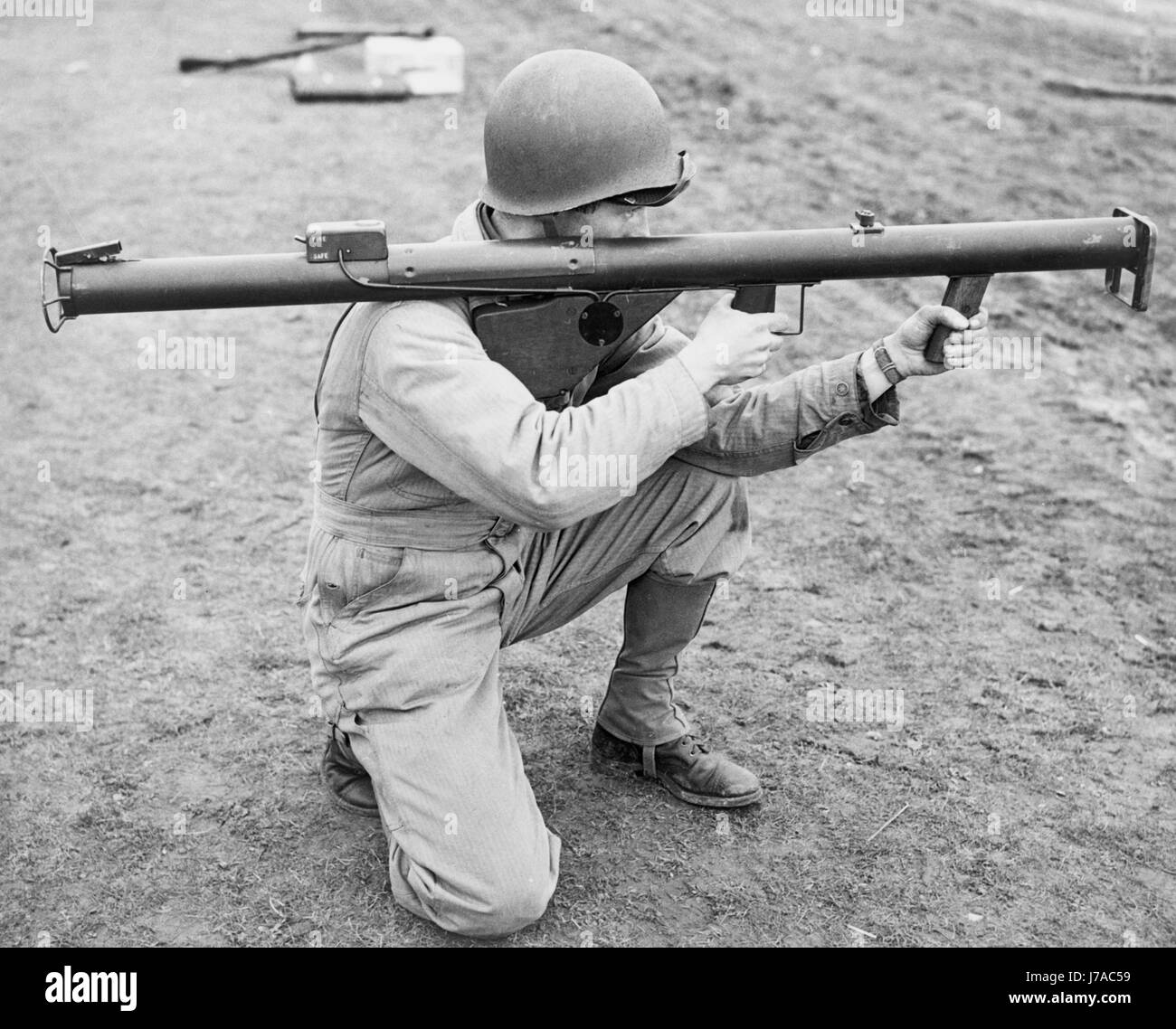 A soldier kneeling and aiming a bazooka, 1943, England. Stock Photo