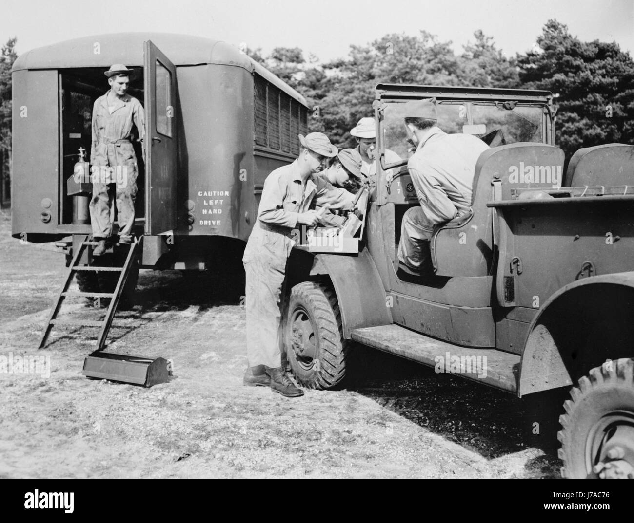 An Army truck being repaired at a mobile unit in England, circa 1942. Stock Photo