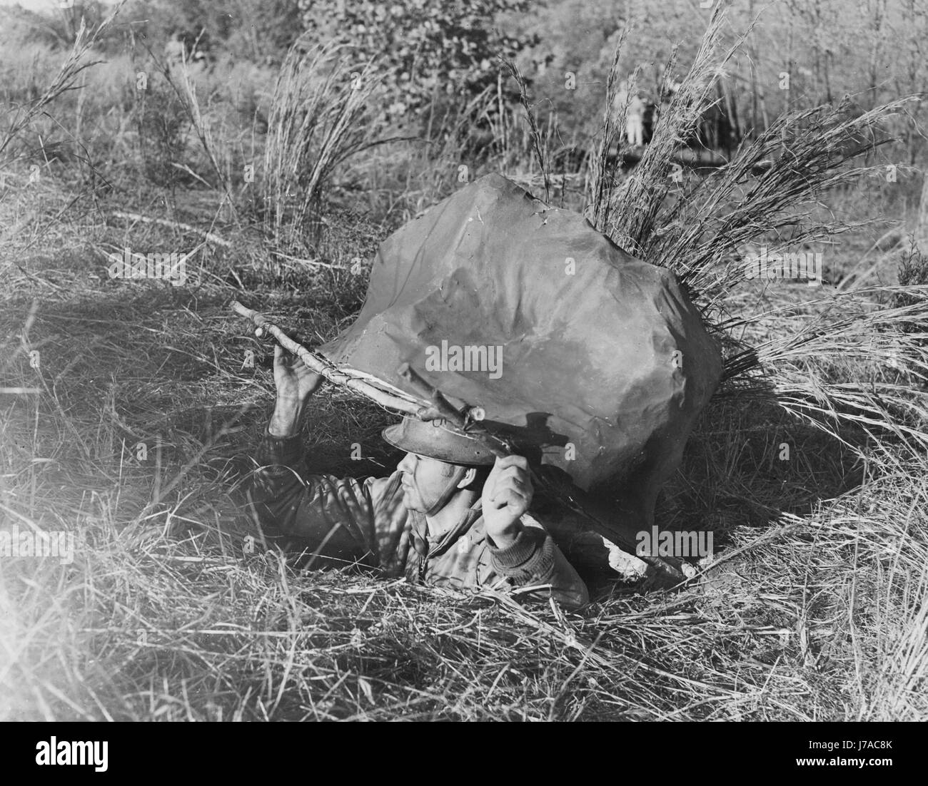 Soldier hiding wwii hi-res stock photography and images - Alamy