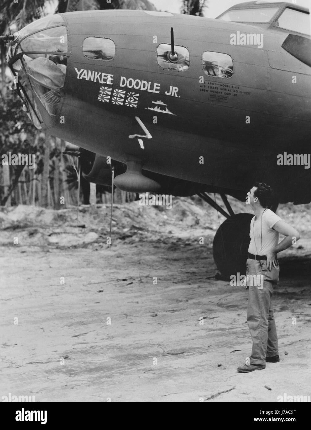 American soldier admiring the B-17 Flying Fortress, circa 1942. Stock Photo