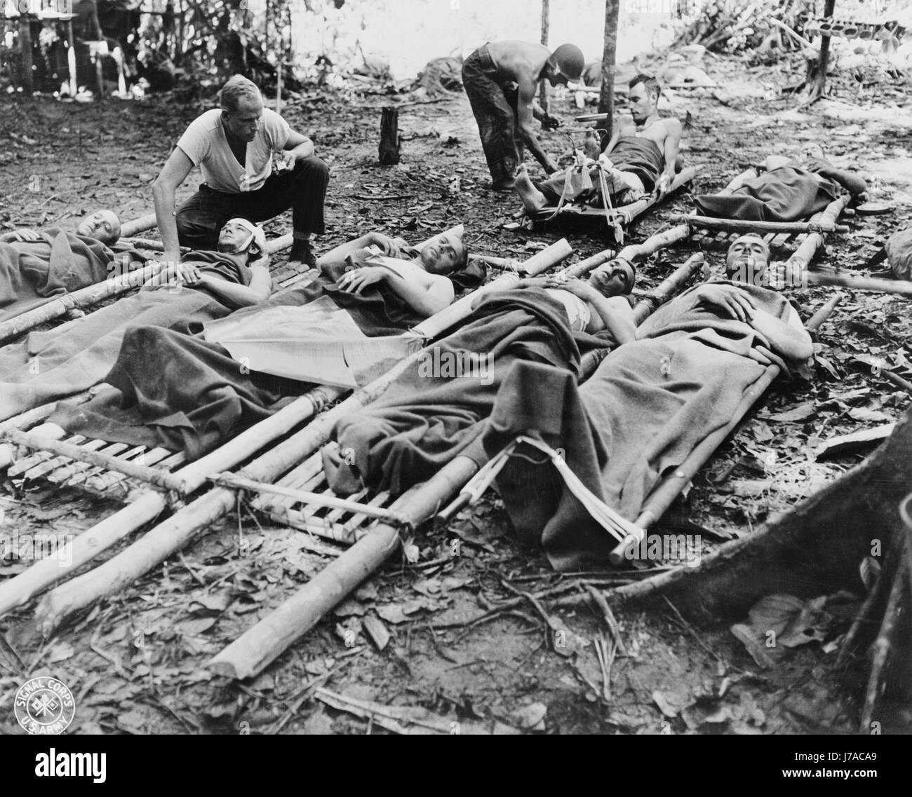 Wounded American soldiers given medical attention in New Guinea, circa 1942-1945. Stock Photo