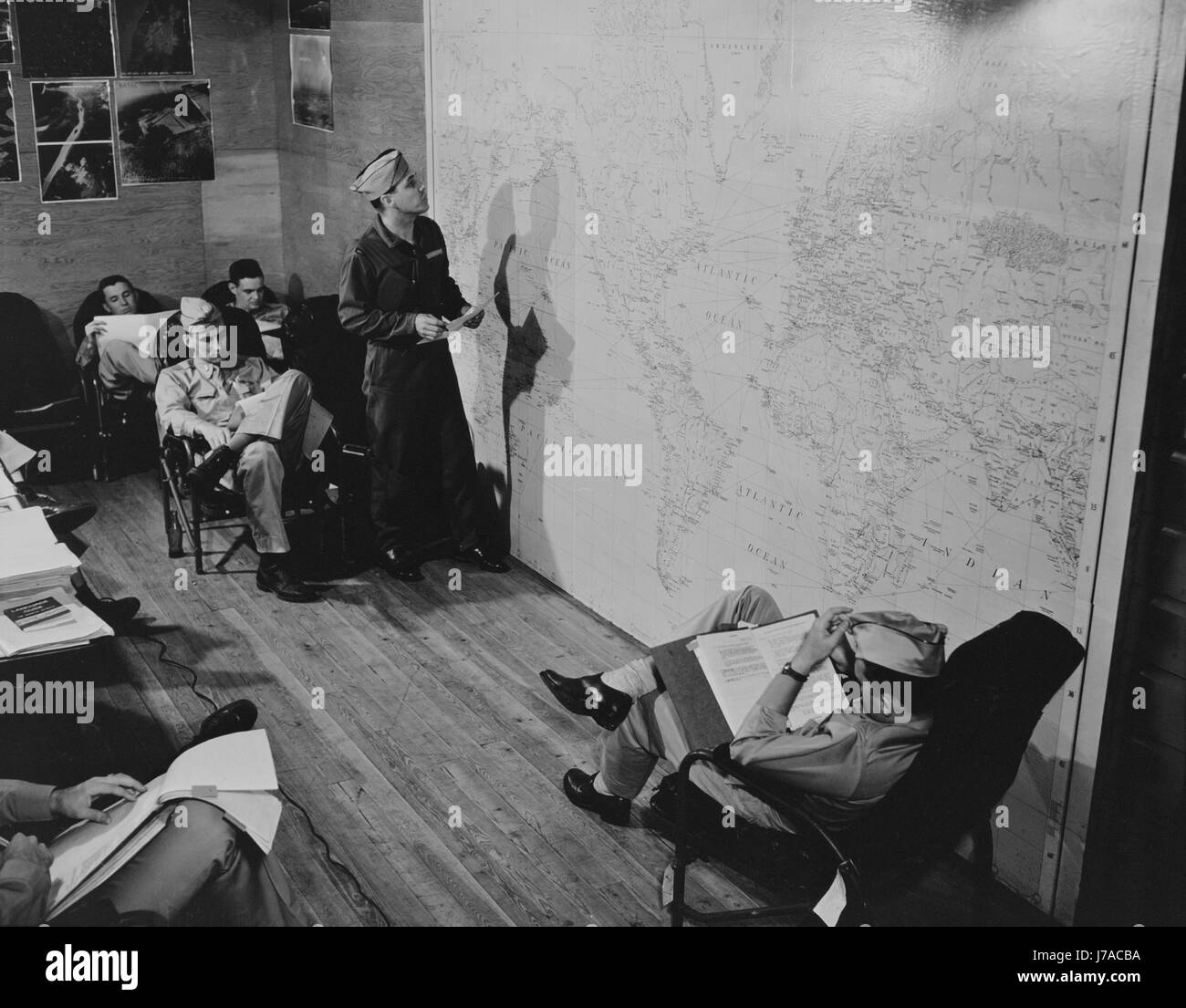 Pilots of the United States Army air transport command studying a map, 1943. Stock Photo