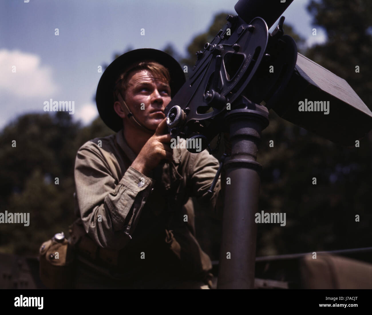 A U.S. soldier shooting a 30 caliber Browning machine gun. Stock Photo