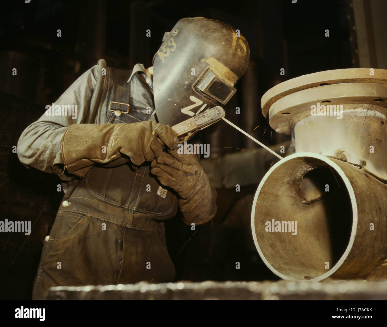 Welder making boilers for a ship, 1942. Stock Photo