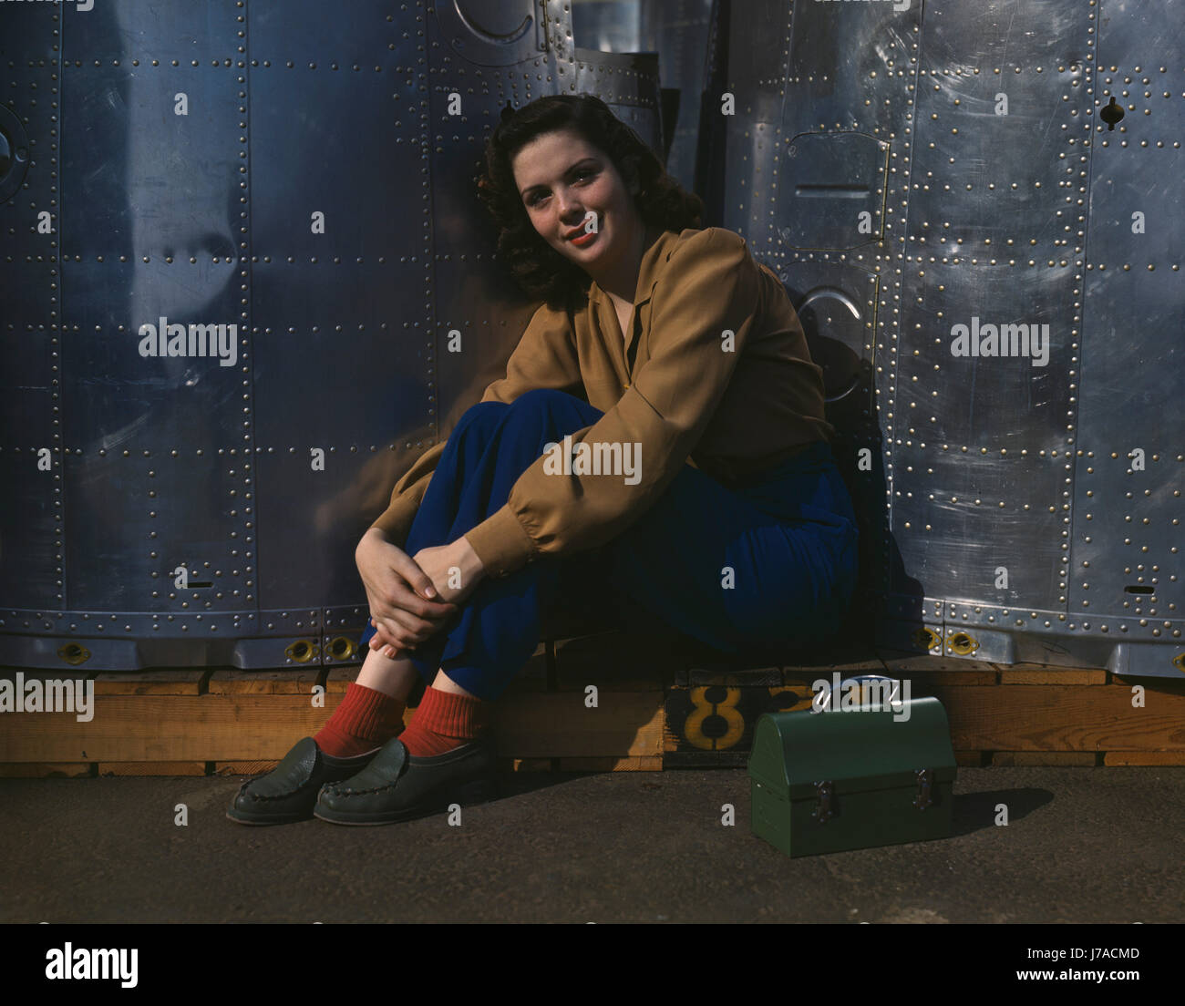 A noontime rest for a woman worker at an aircraft assembly plant, 1942. Stock Photo