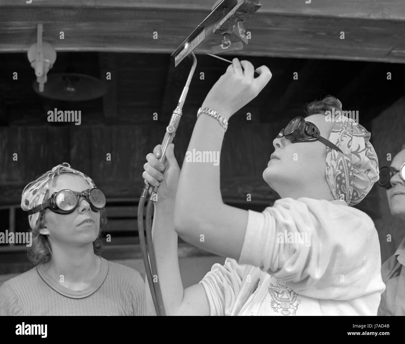 Women learn aircraft welding at a vocational school in Florida, circa 1940's. Stock Photo