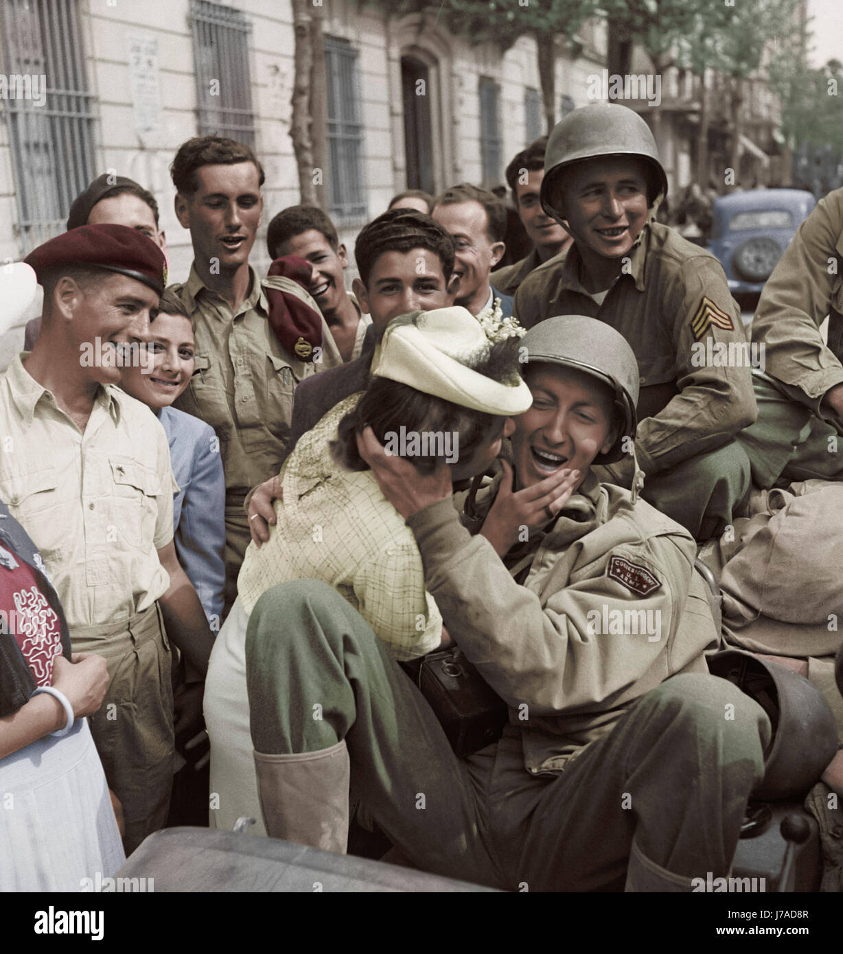 U.S. Army soldier is welcomed with a kiss by a young lady in Porto
