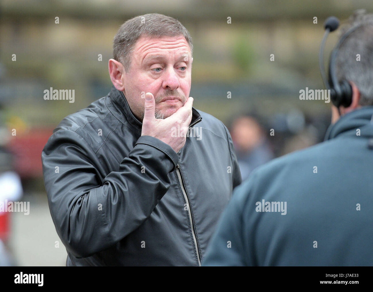 Happy Mondays singer Shaun Ryder is interviewed outside Manchester Town Hall after a suicide bomber killed 22 people leaving a pop concert at the Manchester Arena on Monday night. Stock Photo