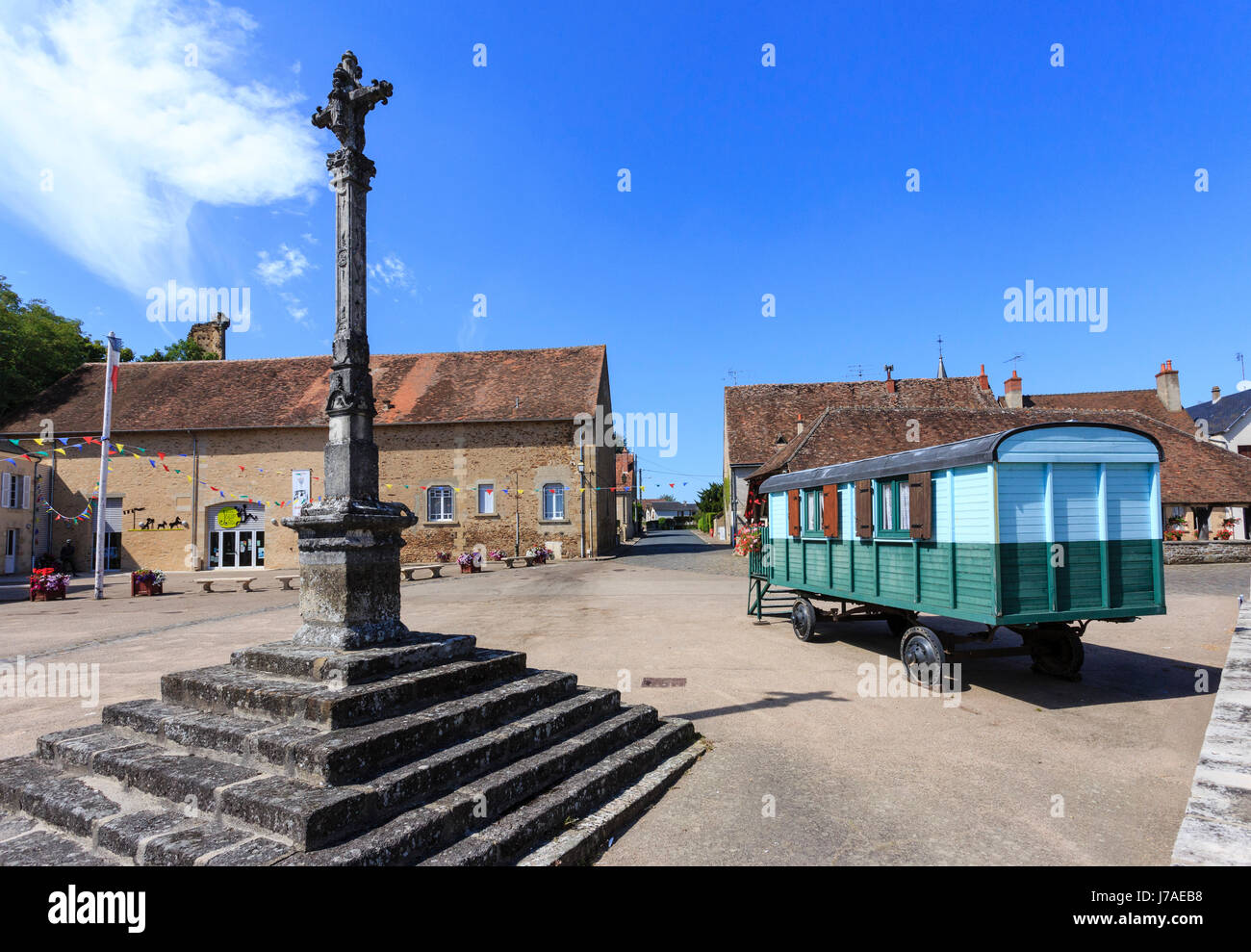 France, Indre, Sainte Severe sur Indre, Marche square, calvary and elements evoking the movie Jour de Fete (the Big Day) by Jacques Tati Stock Photo