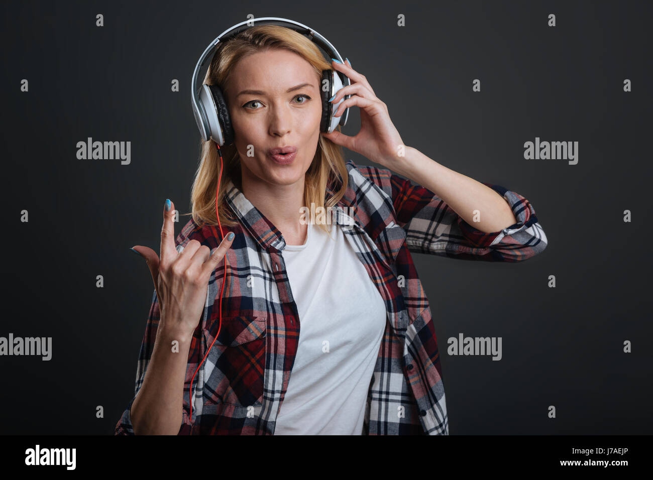 Stunning positive woman enjoying her playlist Stock Photo