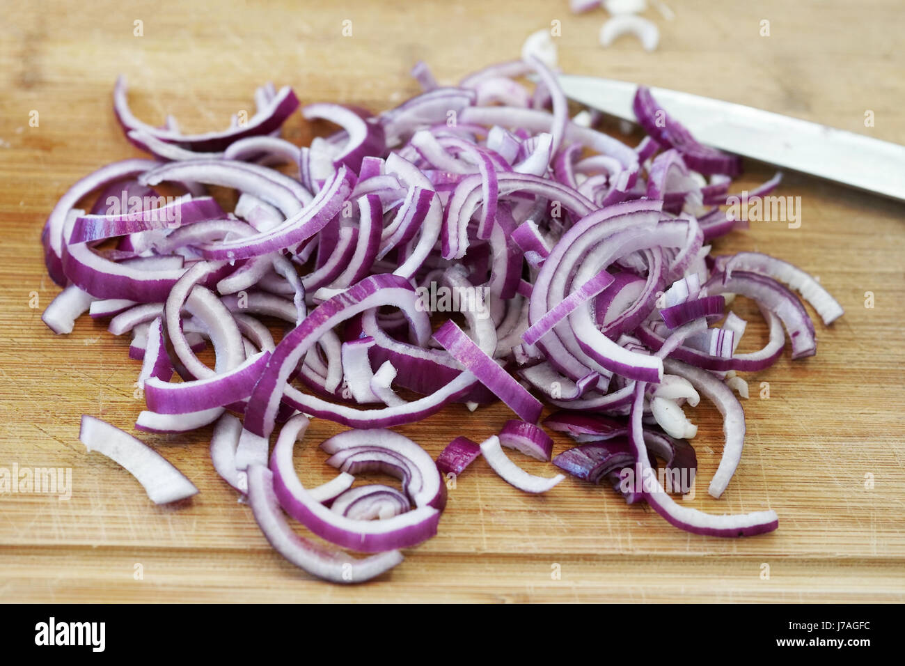Cutting shallot on board hi-res stock photography and images - Alamy