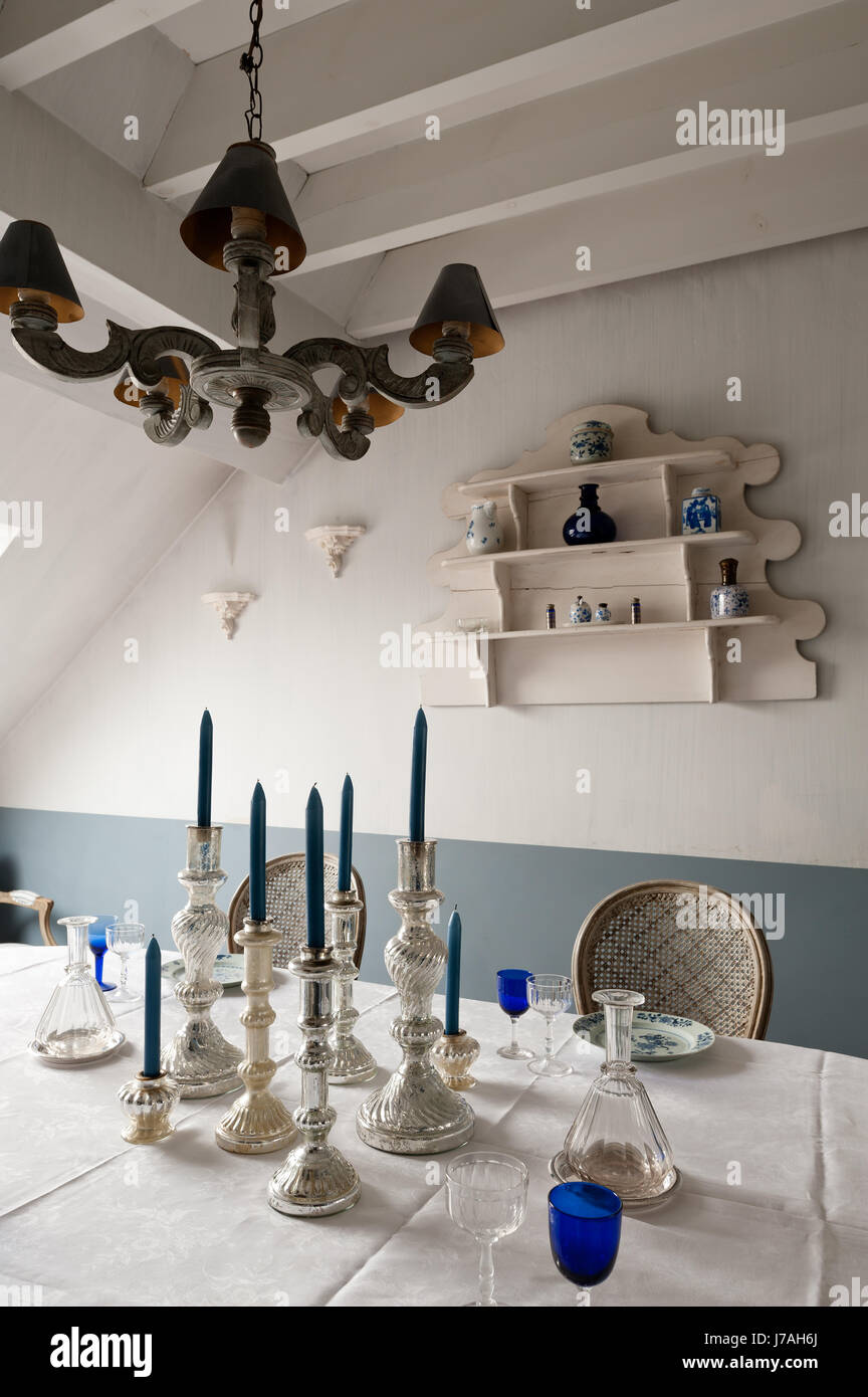 Silverware Candlesticks On Dining Table With Corner Cabinet Stock