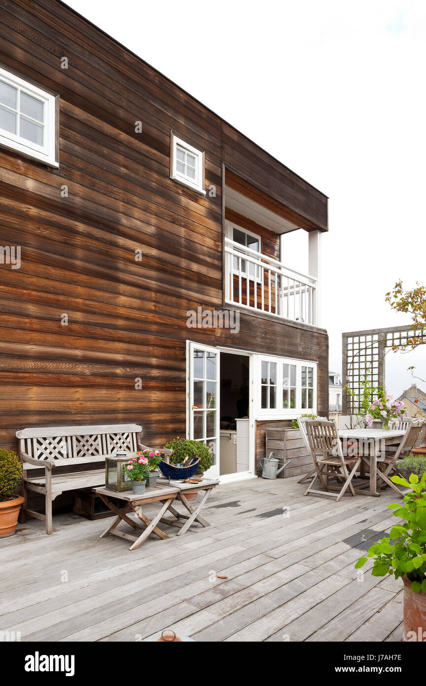 Spacious terrace accessed from French windows leading from kitchen Stock Photo