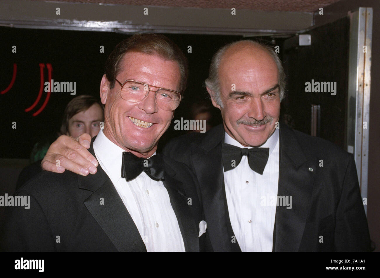 File photo dated 08/10/1990 of Sir Roger Moore, left, and Sir Sean