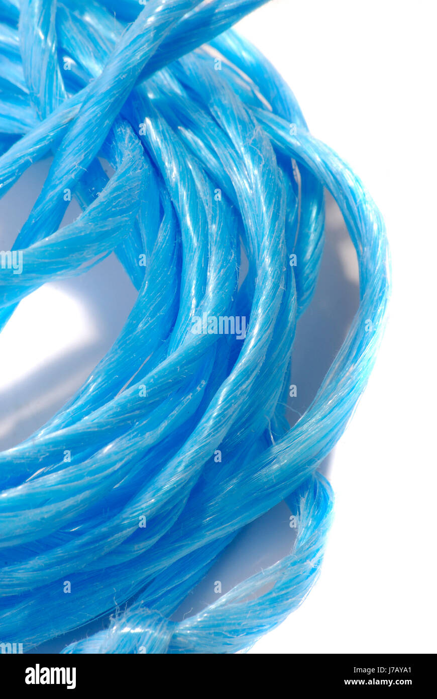 blue household dew cord unrolled rope twine string blue macro close-up macro Stock Photo