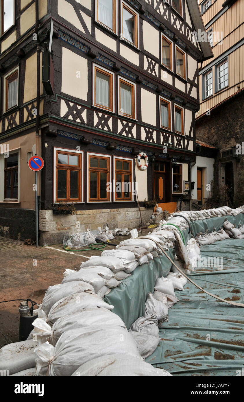 frame-work flood natural disaster melting of snow sandbag sandbags old town Stock Photo