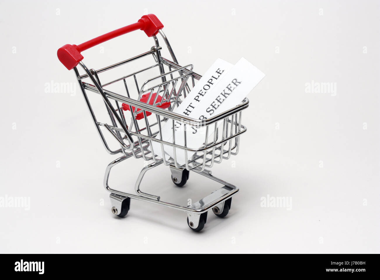 Employee in search of a right candidate in the market for his company. He is out with the shopping cart and picking up the right candidates. Stock Photo