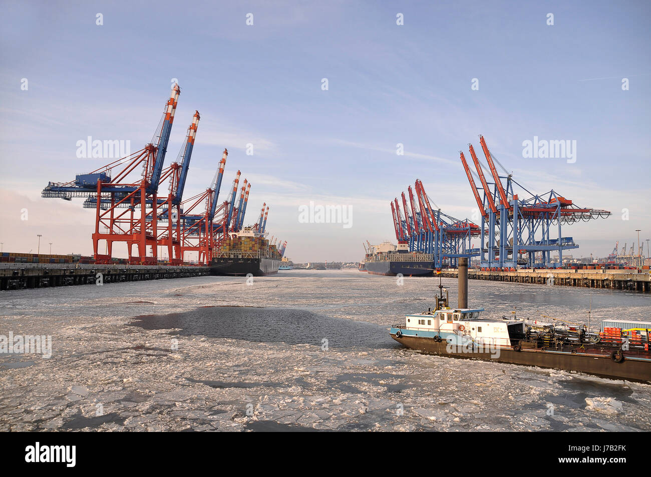 cranes ship discharge container containers crane container ship harbor hamburg Stock Photo