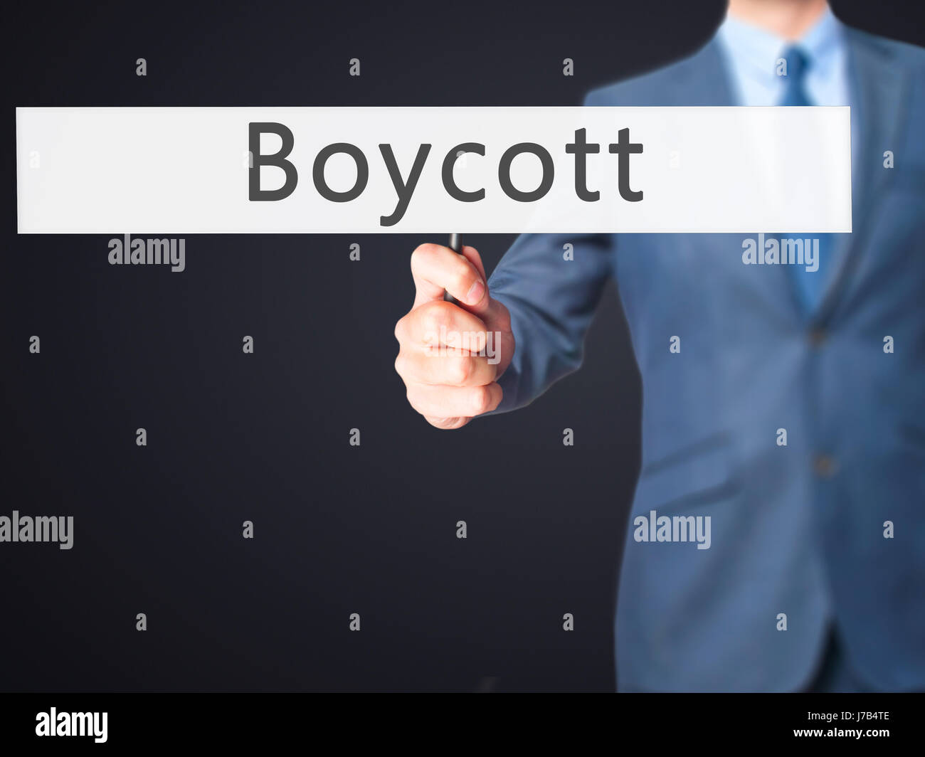 Boycott - Businessman hand holding sign. Business, technology, internet ...