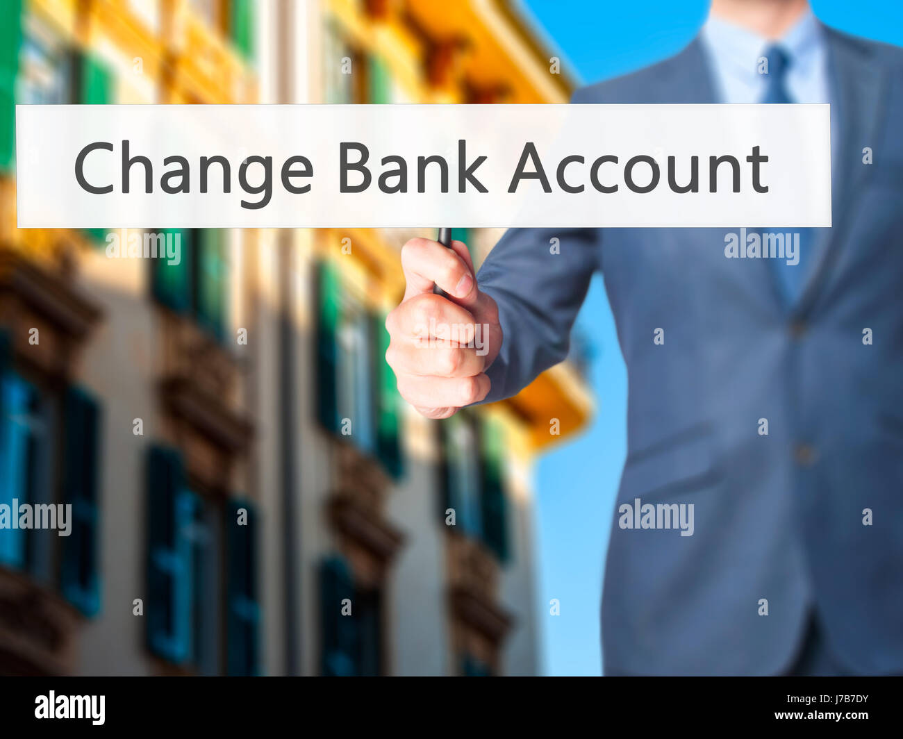 Change Bank Account Businessman hand holding sign. Business, technology, concept