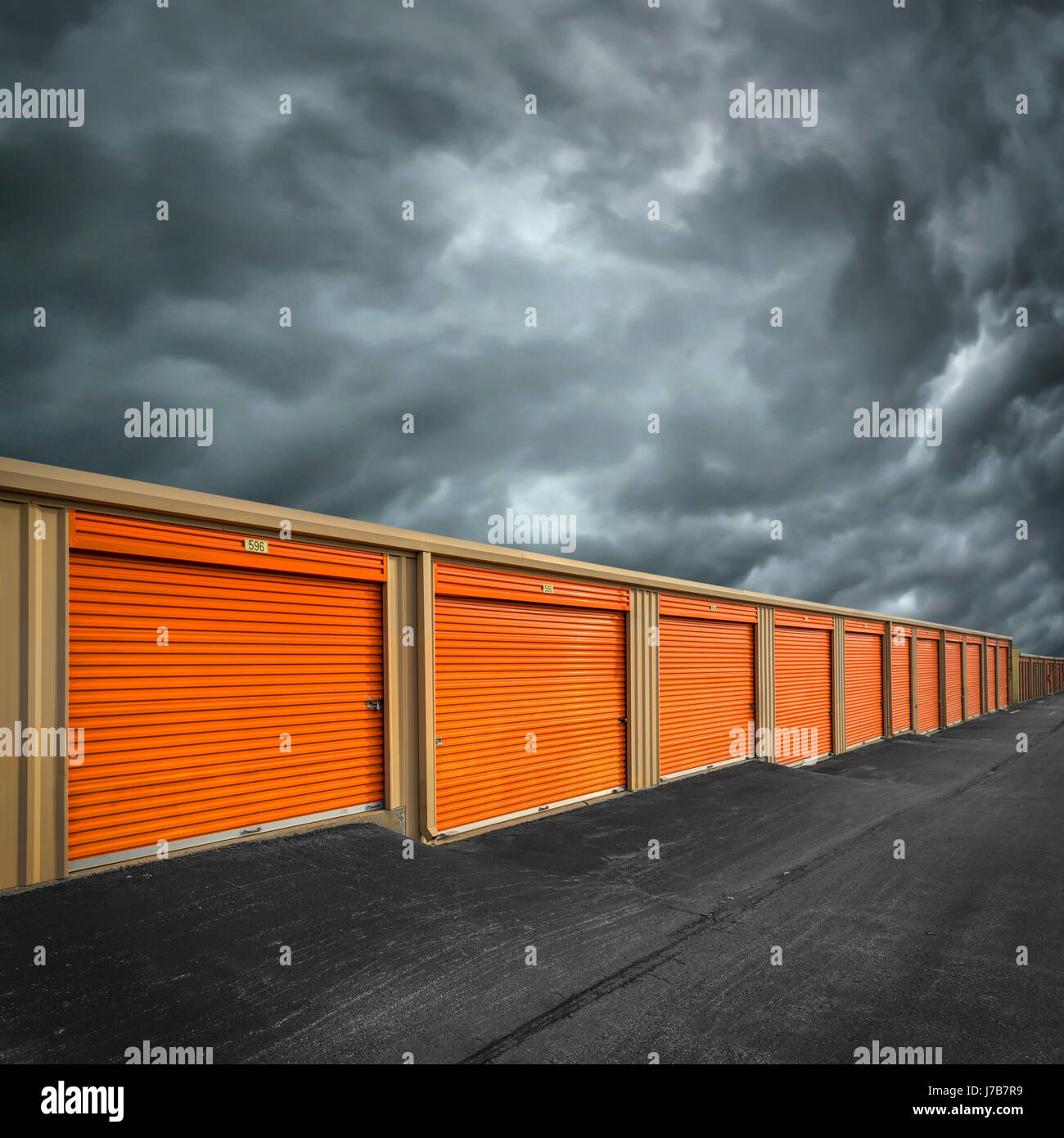 Orange Self Storage Units With Approaching Storm Stock Photo