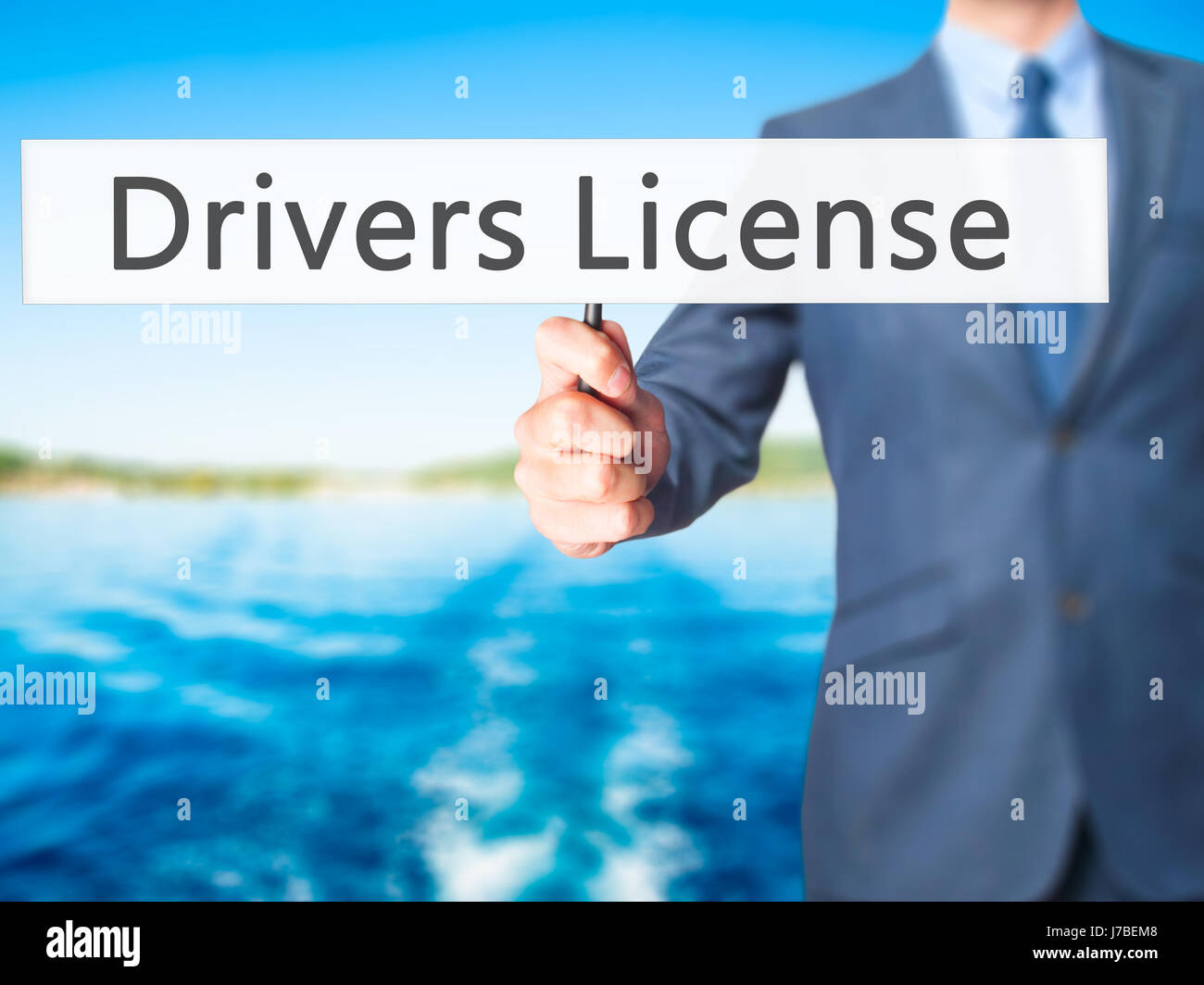 Drivers License - Businessman hand holding sign. Business, technology