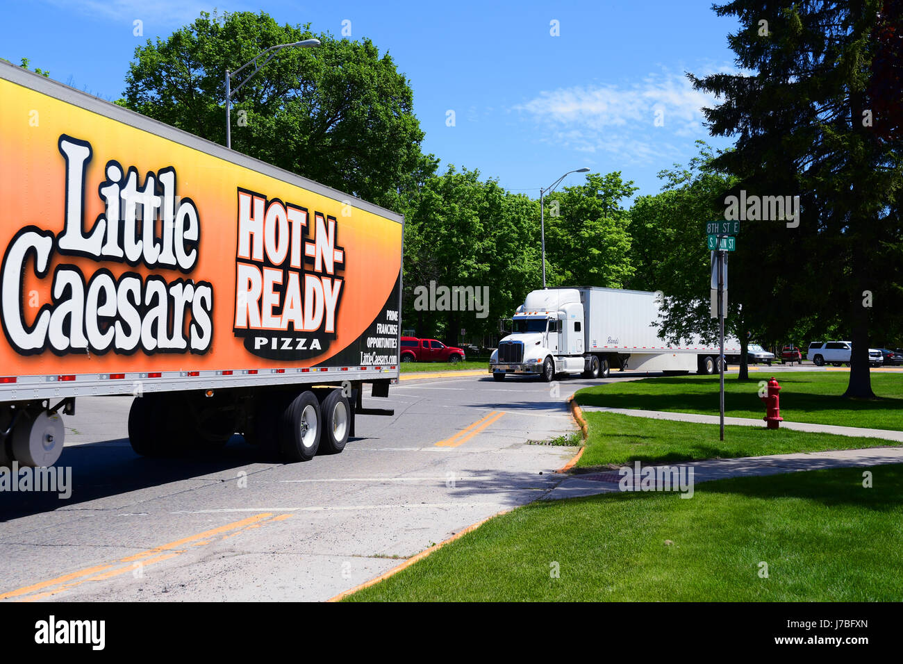 KALISPELL, MONTANA, USA - May 23, 2017: A Little Caesars Pizza semi-truck convoys with another semi through the streets of Kalispell Stock Photo