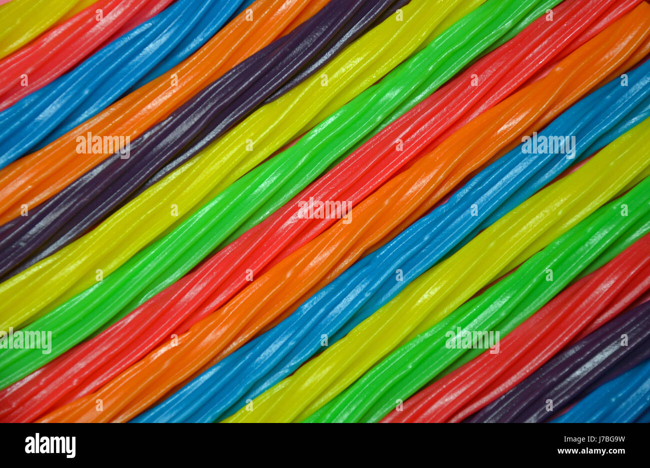 Rainbow colored licorice candy background Stock Photo Alamy