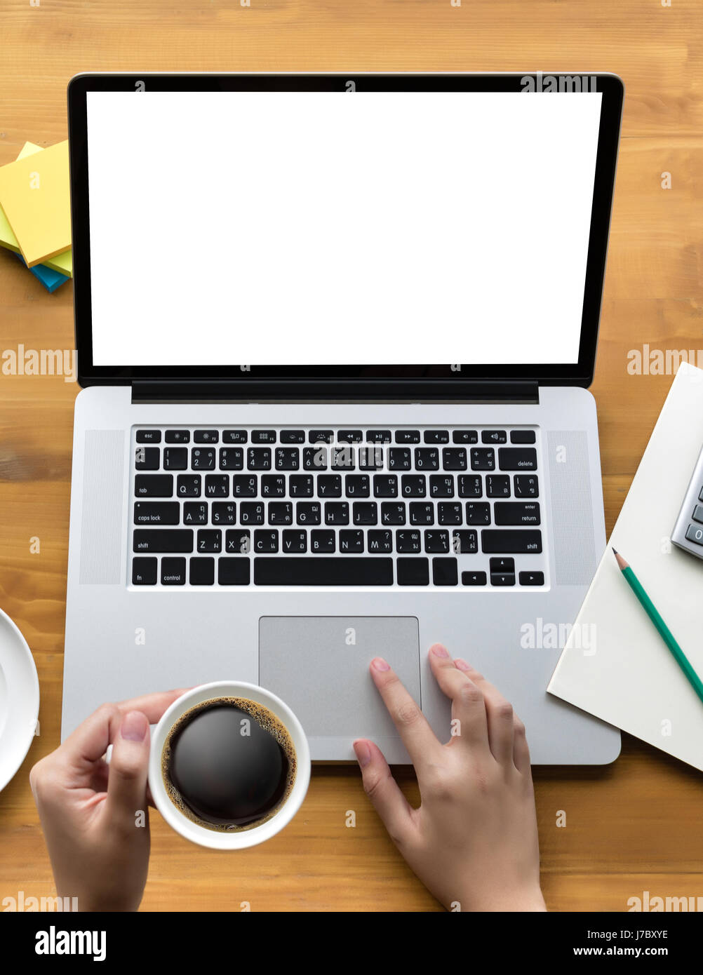 Laptop with blank screen on table businessman working in office and ...