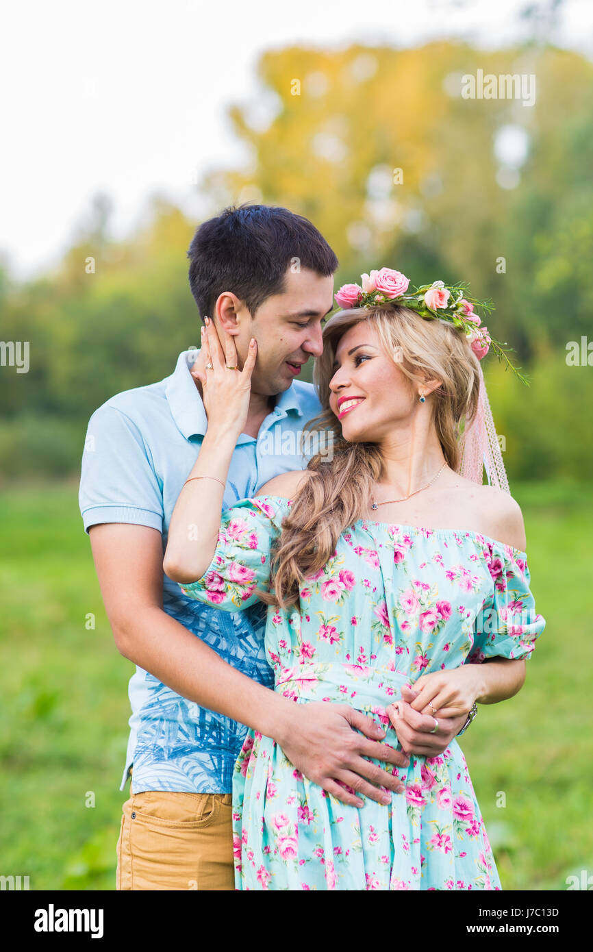 beautiful young couple hugging in the park Stock Photo - Alamy