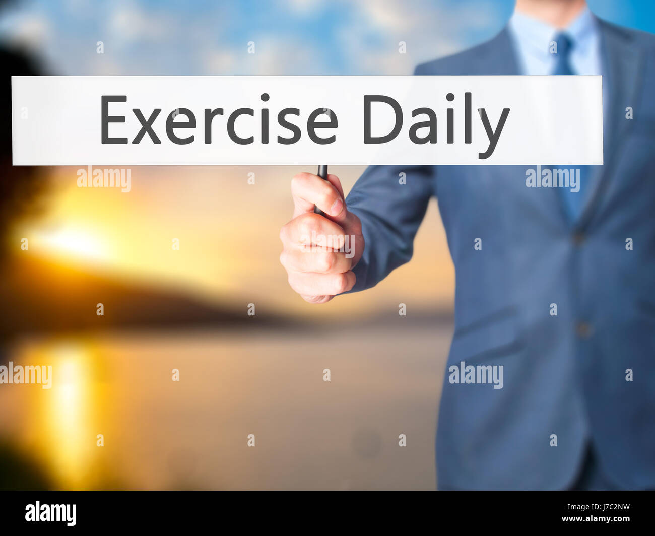 Exercise Daily - Businessman hand holding sign. Business, technology ...