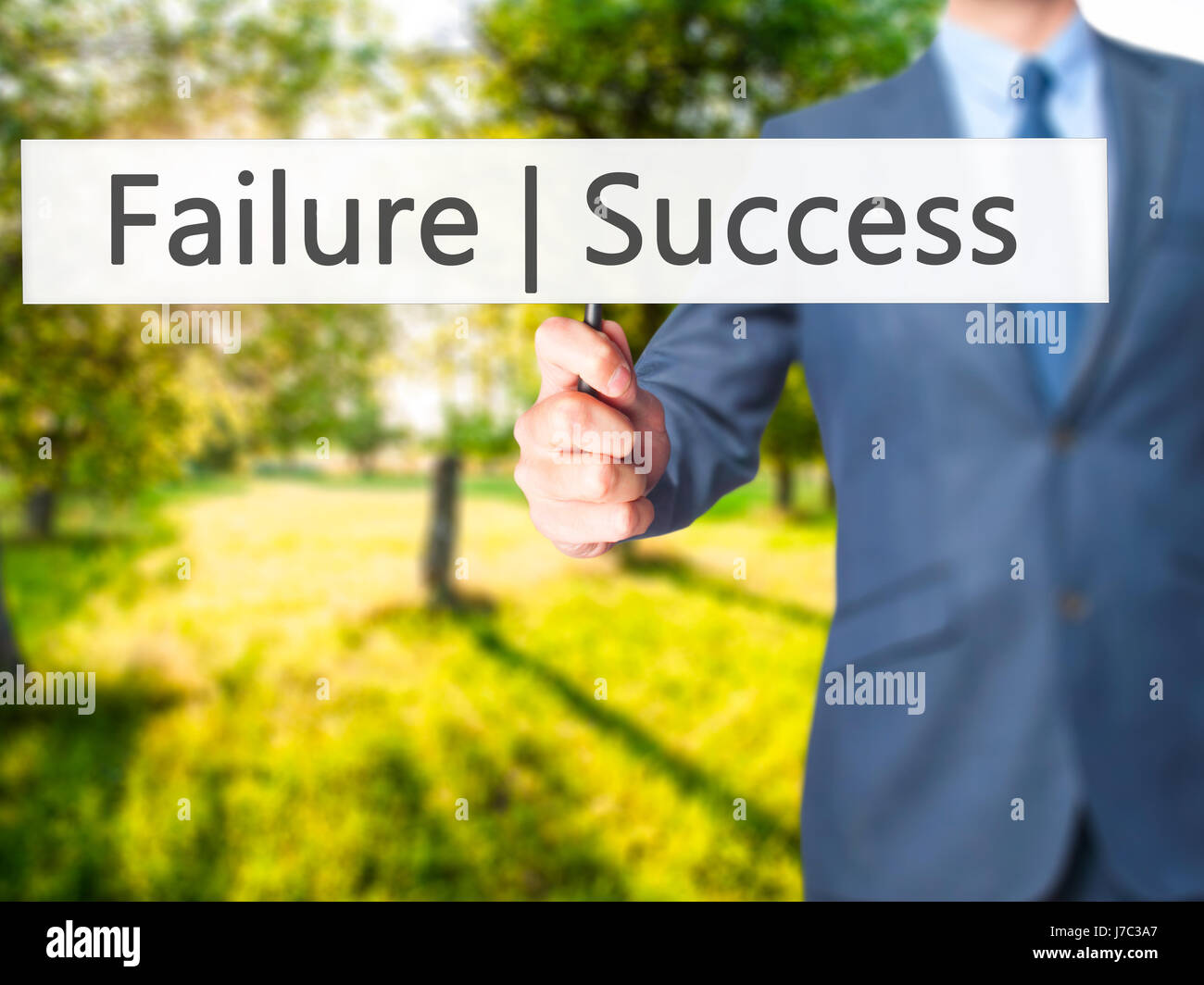 Failure Success - Businessman hand holding sign. Business, technology ...