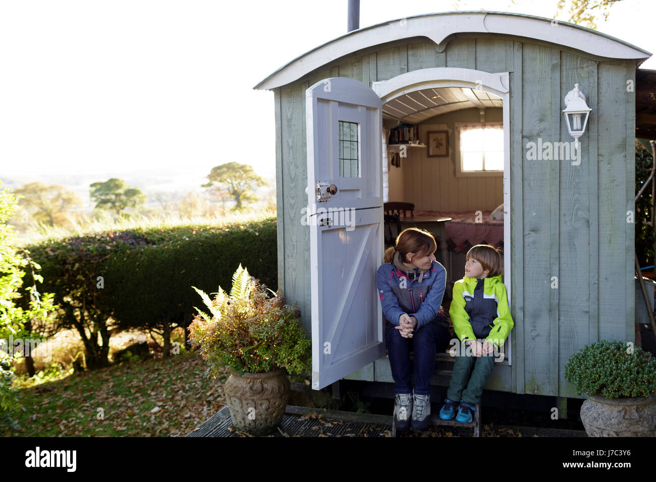 Mother and son at a glamping hut, Scottish borders, UK. Stock Photo