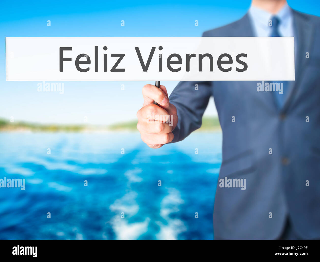 Feliz Viernes Happy Friday In Spanish Businessman Hand Holding Sign