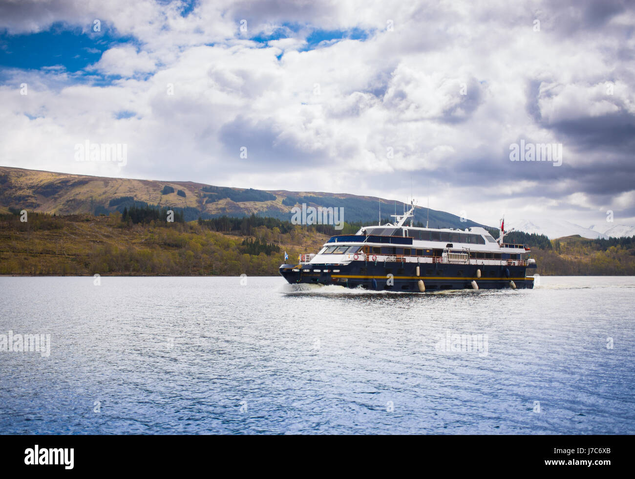 Lord of The Glens boat going through Loch Lochy Stock Photo