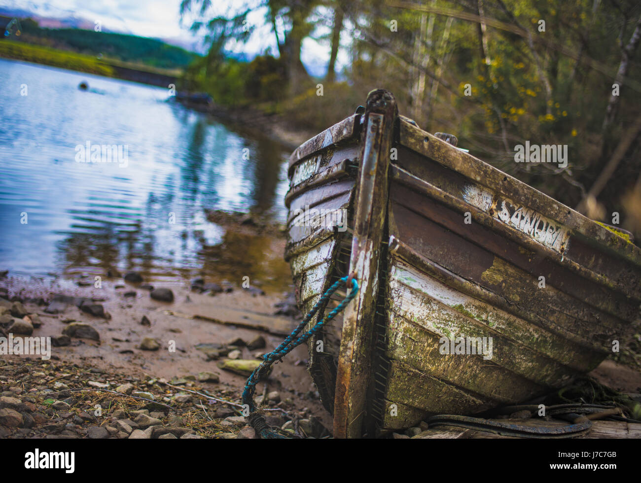 Old wooden dingy at Gairlochy bay Stock Photo