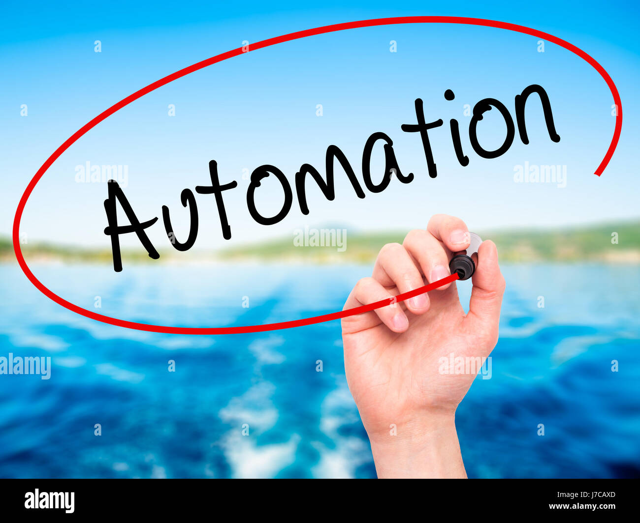 Man Hand writing Automation with black marker on visual screen ...