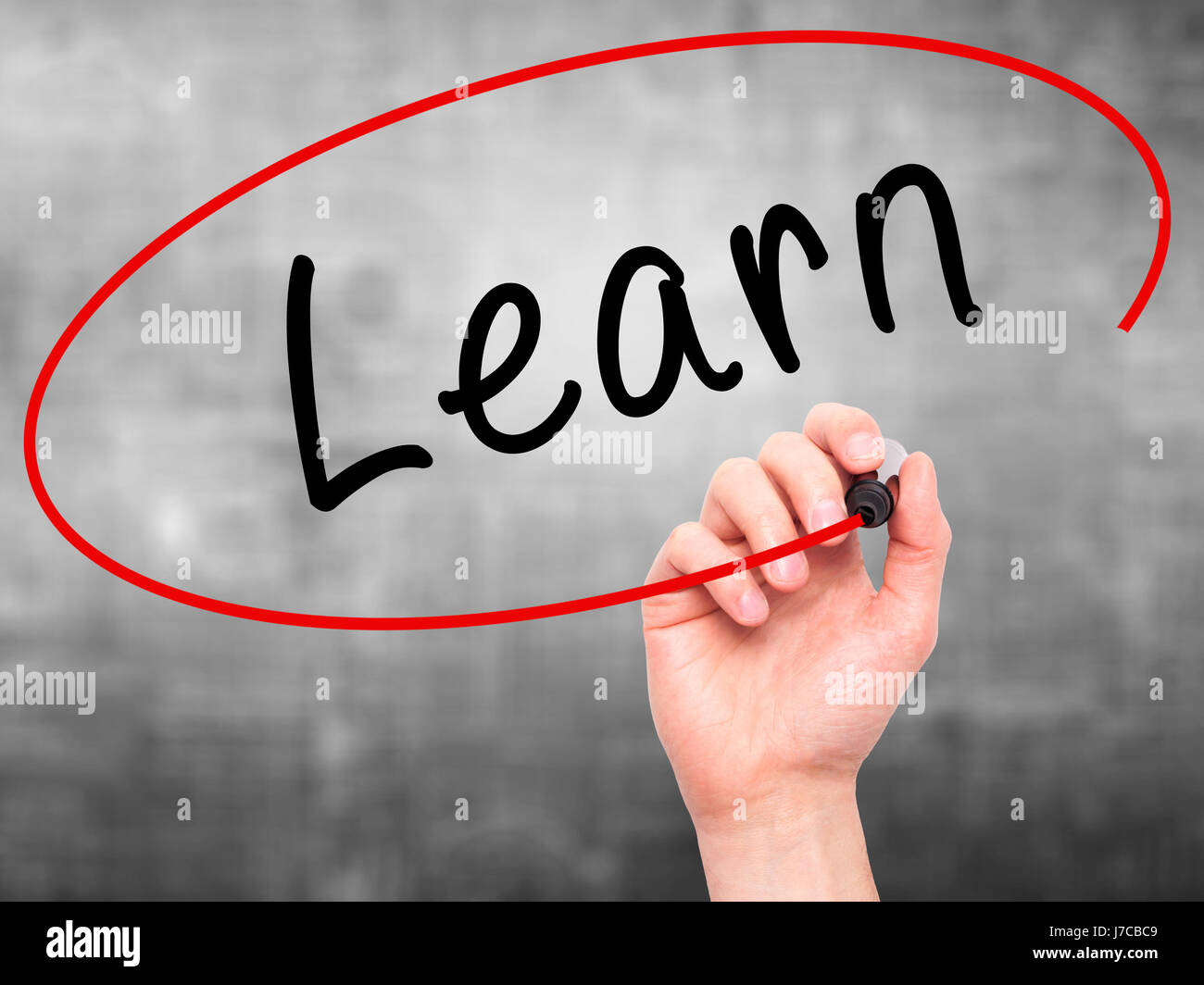 Man Hand writing Learn with black marker on visual screen. Isolated on ...