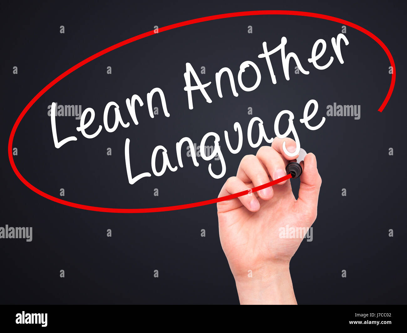 Man Hand writing Learn Another Language with black marker on visual ...