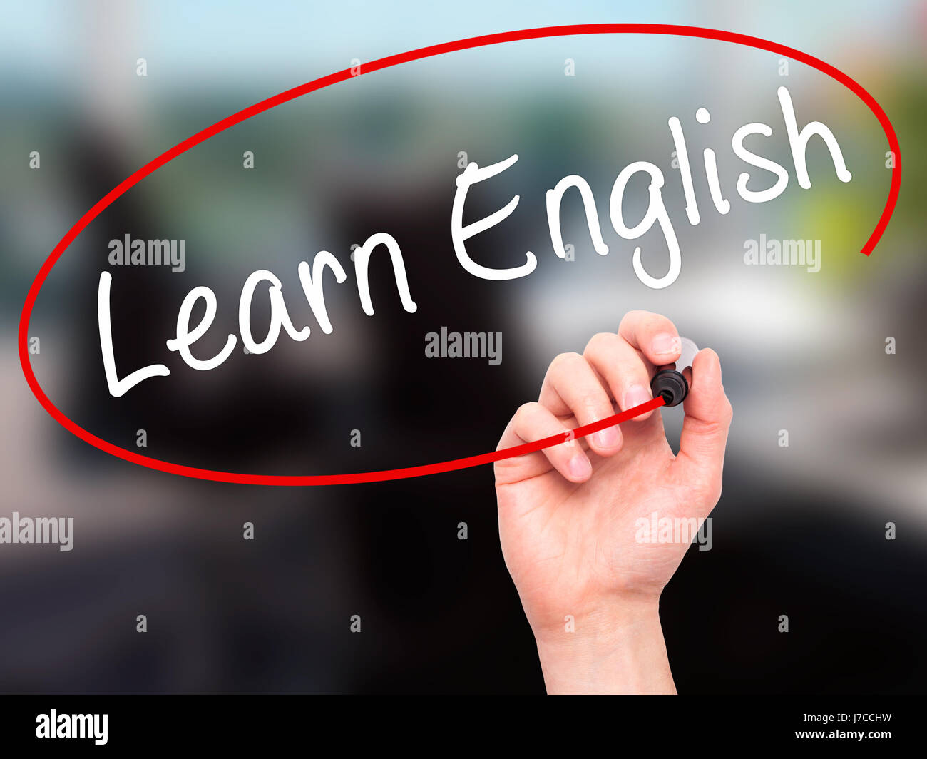Man Hand writing Learn English with black marker on visual screen ...
