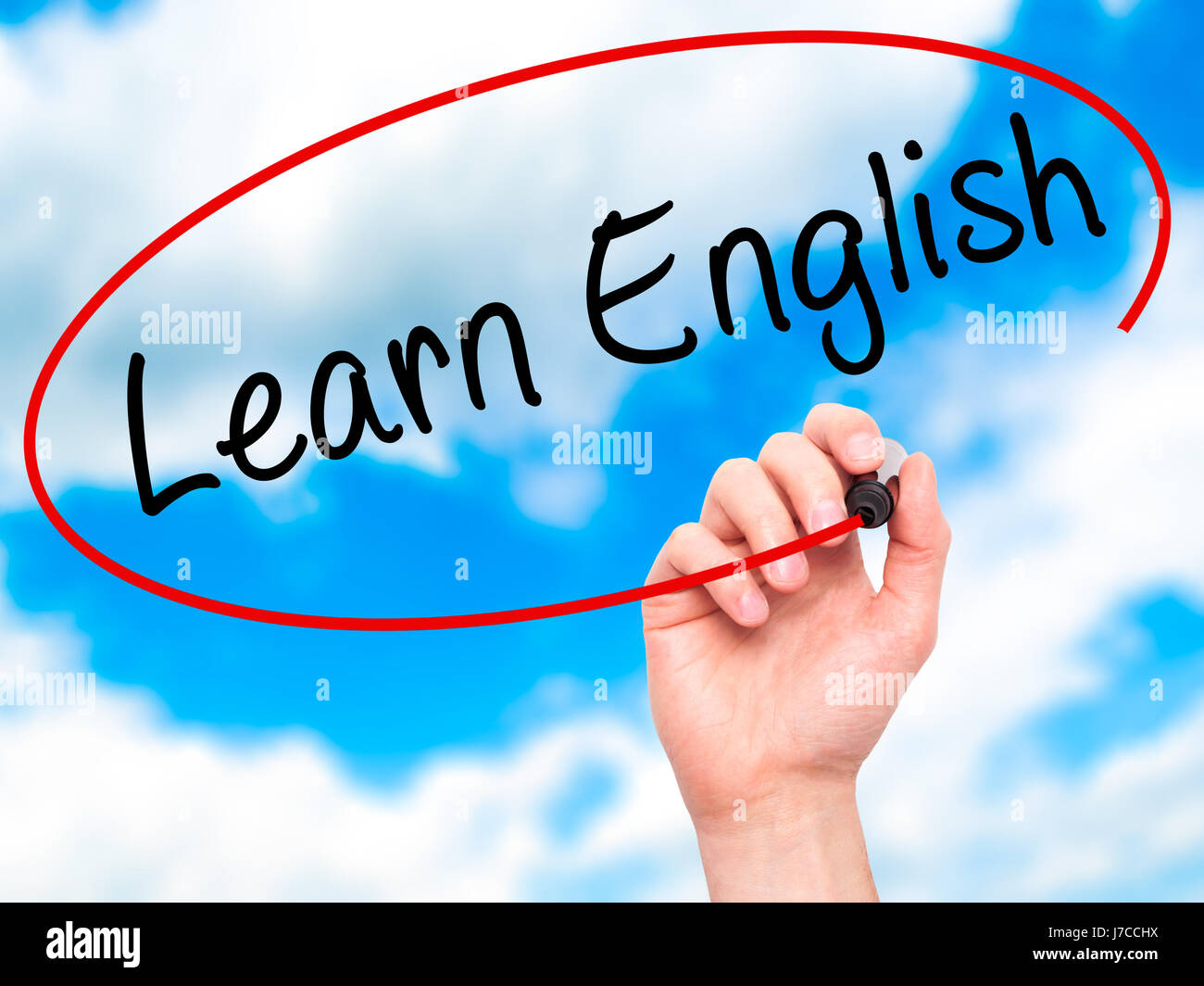 Man Hand writing Learn English with black marker on visual screen ...