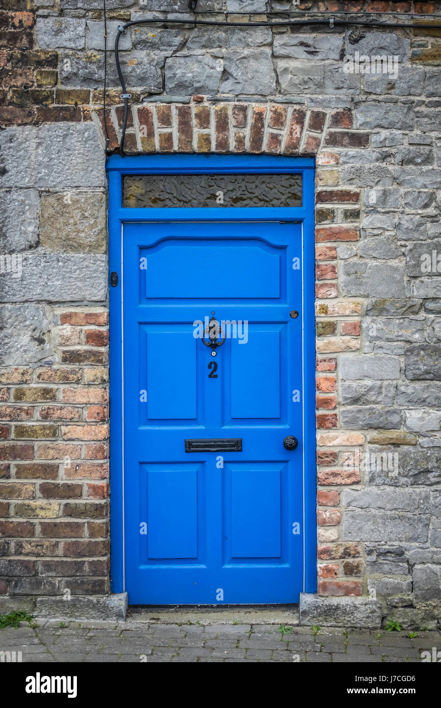 Typical blue front door in an old home in Limerick, Ireland Stock Photo