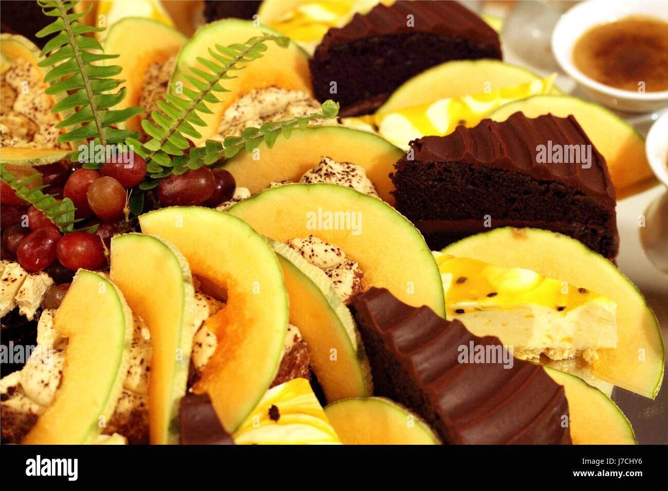 dessert cake pie cakes decoration melon cream sideboard kitchens grapes bunches Stock Photo