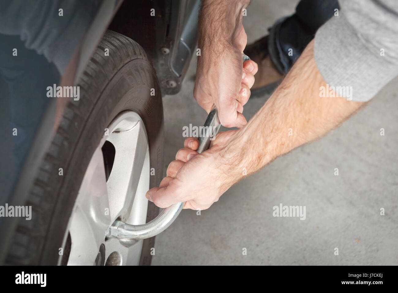 hand wrench change of tyres arm hand macro close-up macro admission close up Stock Photo