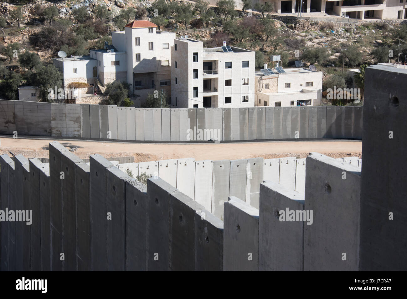 The Israeli Separation Wall divides land belonging to the West Bank village of Beit Jala, December 30, 2016. Stock Photo