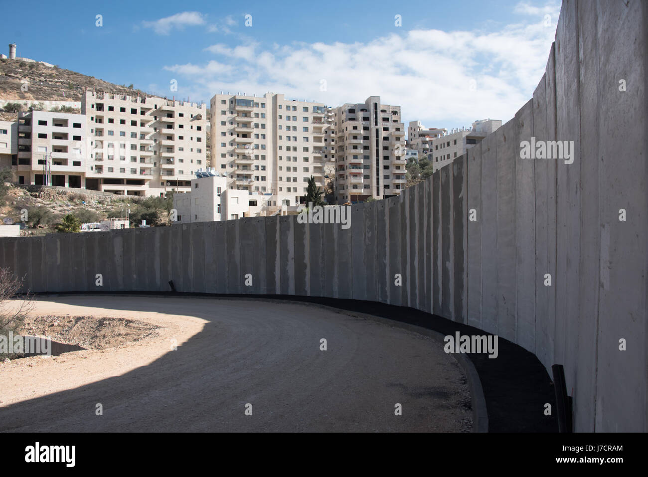 The Israeli Separation Wall divides land belonging to the West Bank village of Beit Jala, December 30, 2016. Stock Photo