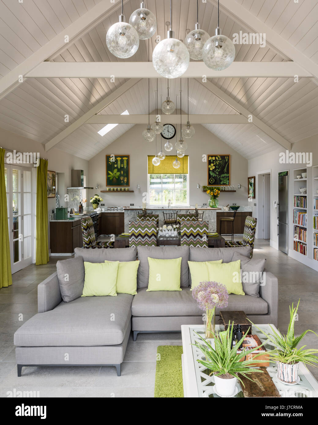 Open plan space with vintage glass globes grouped to define areas and