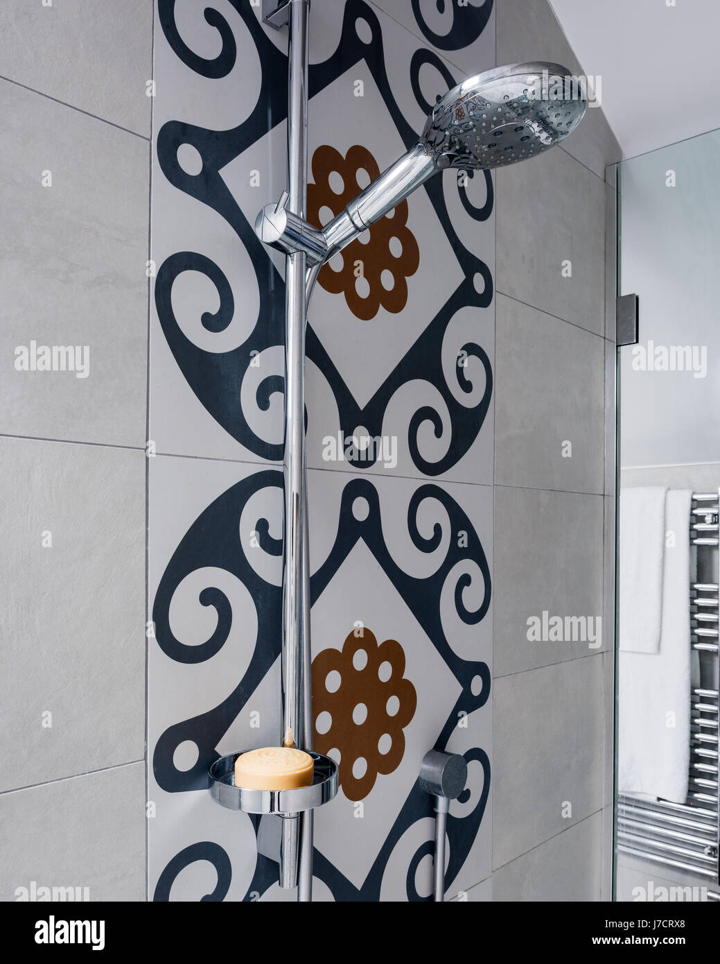 Shower fitting with dramatic Majolica tiles Stock Photo Alamy